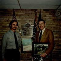 National Park Service presenting John Murtha with photos of Lemon House and South Fork Dam, c. 1970s.