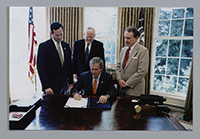 John Murtha, President George W. Bush, Senator Rick Santorum, and Senator Arlen Specter signing legislation, 2006.